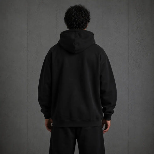 Zwarte oversized hoodie met capuchon en lange mouwen, achteraanzicht