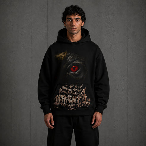 Zwarte oversized hoodie met capuchon en grote oogprint op de borst