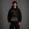 Zwarte oversized hoodie met capuchon en grote oogprint op de borst