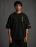 Zwart oversized T-shirt met boxy fit, print op voorzijde en oranje mouwpatch