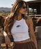 Witte cropped tanktop met koeienprint borstpatch en racerhals